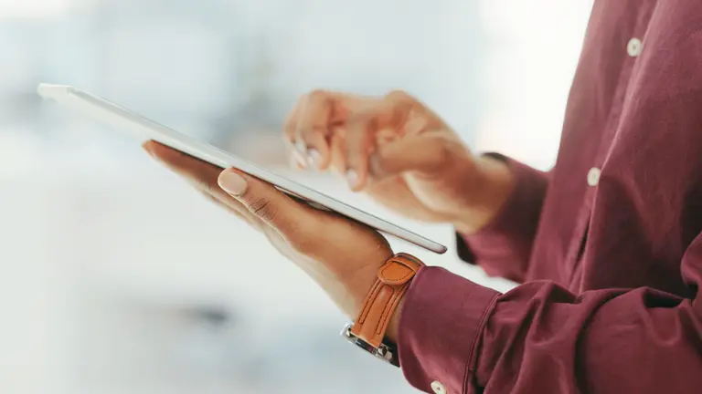 Person holding a tablet